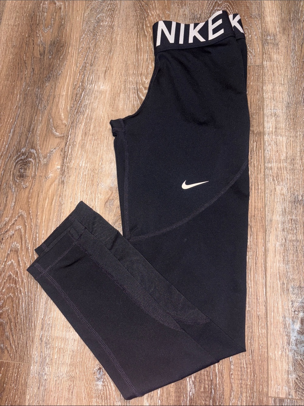 Nike Black Girls' Athletic Leggings with White Swoosh and Logo Waistband